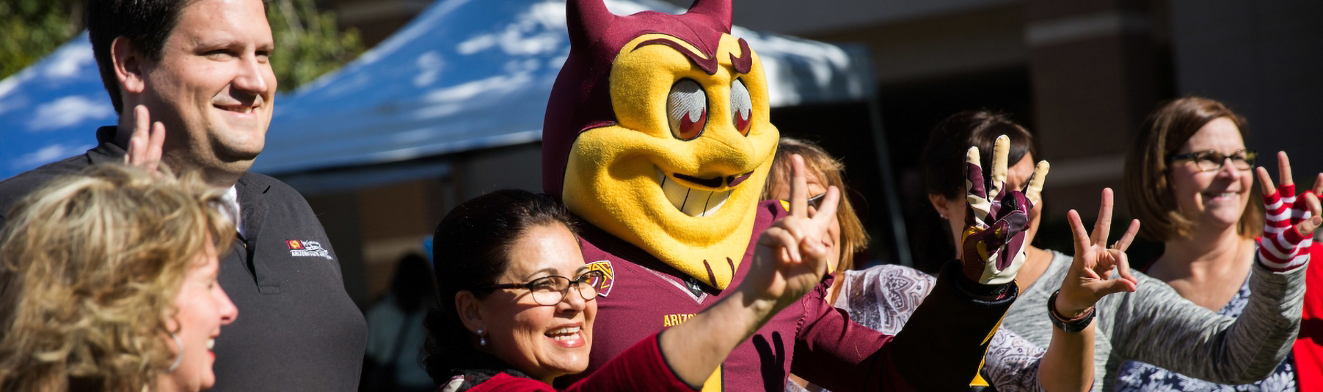 ASU Staff and Sparky mascot on campus