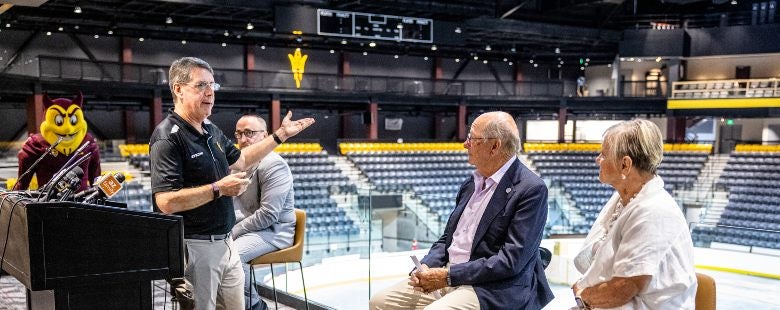 Dr. Morgan R. Olsen, ASU’s executive vice president, treasurer and chief financial officer, speaks to Don and Barbara Mullett on Tuesday, Aug. 23, at the naming of the new Mullett Arena.