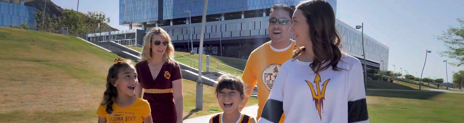 Photo of a family walking by the Tempe Town Lake.
