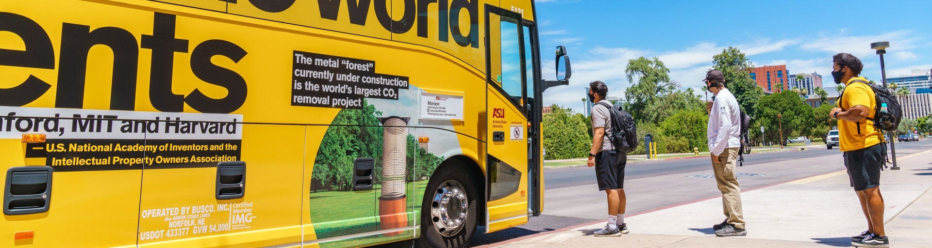 Photo of ASU students boarding the gold intercampus shuttle.