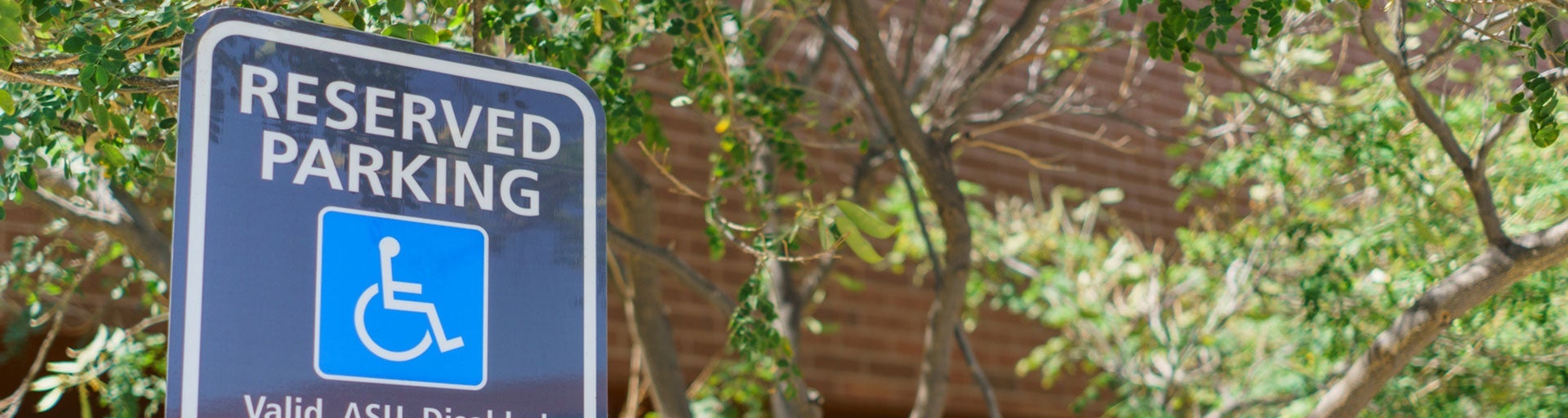 Photo of a reserved parking sign for accessible parking.