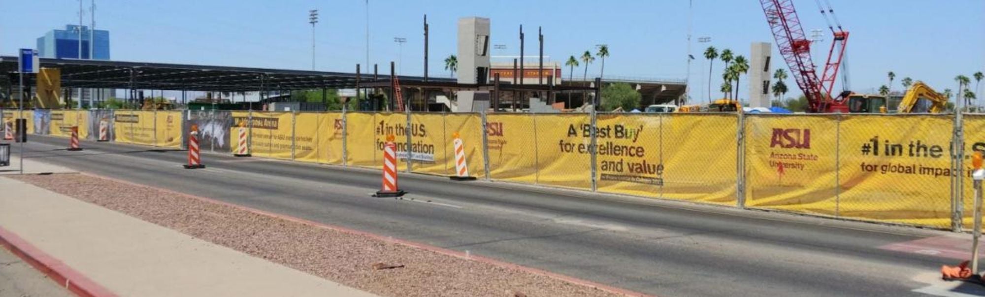 A view of construction fence banners on ASU's Tempe campus