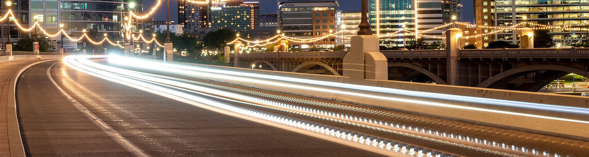 Lights from cars passing by the Tempe Town Lake bridge.